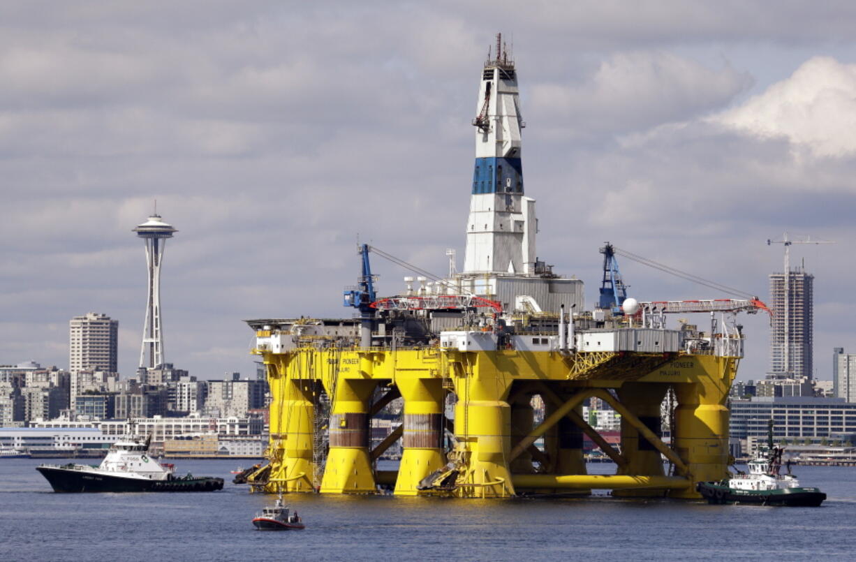 The oil drilling rig Polar Pioneer is towed toward a dock in Elliott Bay in Seattle. The rig was the first of two drilling rigs Royal Dutch Shell was outfitting for Arctic oil exploration. President Barack Obama is expected to order wide swaths of the Atlantic and Arctic oceans placed permanently off-limits for oil drilling, in an 11th-hour push for environmental protection before he leaves office.