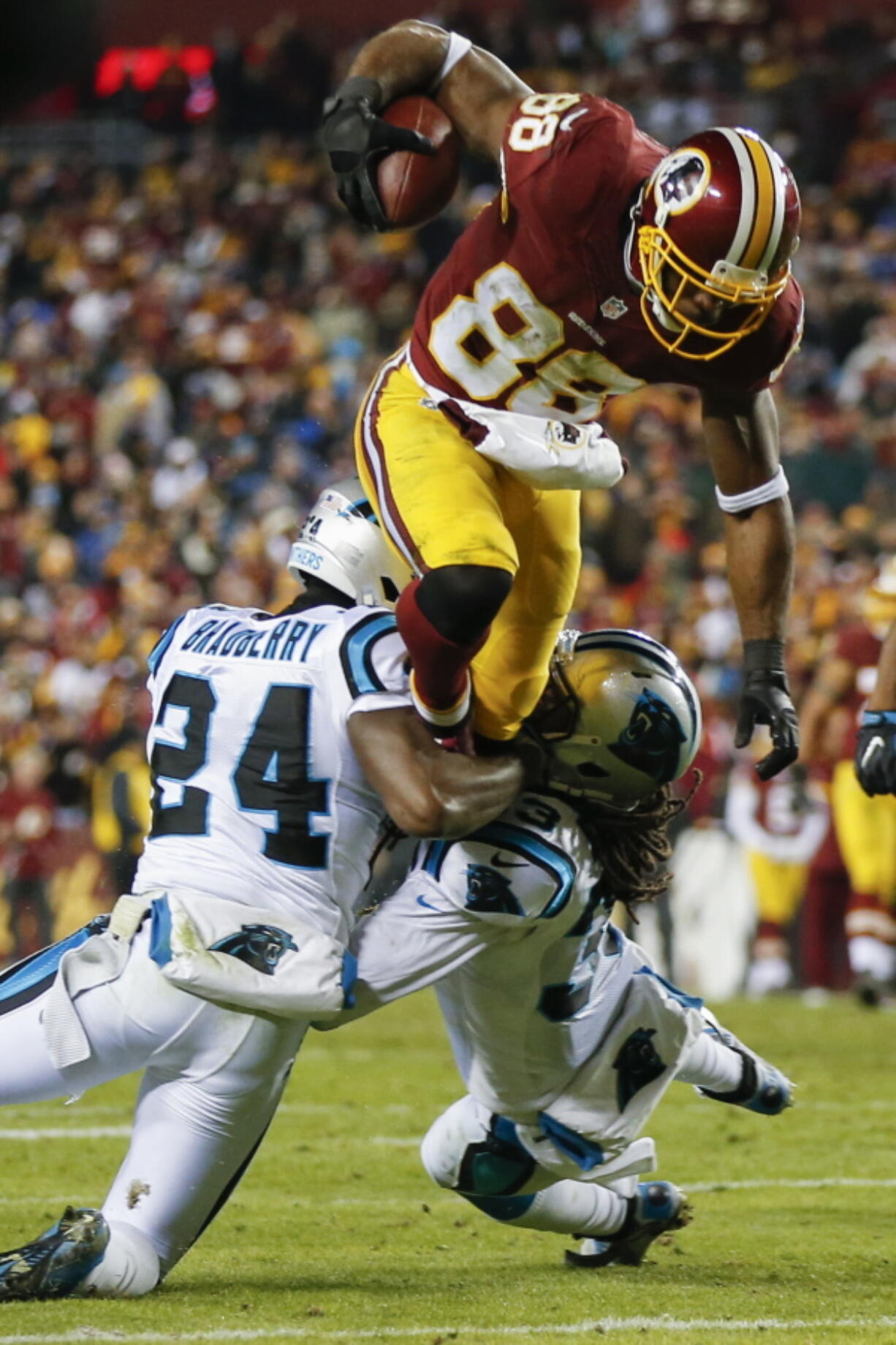 Washington wide receiver Pierre Gar?on (88) runs over the top of Carolina&#039;s James Bradberry (24) and Tre Boston.