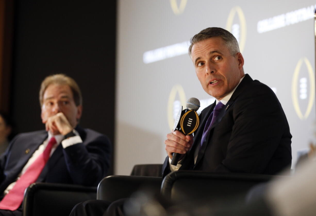 Washington head football coach Chris Petersen, right, speaks as Alabama head coach Nick Saban looks on during a news conference with the four coaches playing in the college football playoffs Thursday, Dec. 8, 2016, in Atlanta.