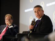 Washington head football coach Chris Petersen, right, speaks as Alabama head coach Nick Saban looks on during a news conference with the four coaches playing in the college football playoffs Thursday, Dec. 8, 2016, in Atlanta.