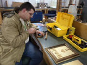 Raymond Marshall works in a wood shop at the Special Commitment Center for sex offenders Feb. 5, 2003, at McNeil Island.