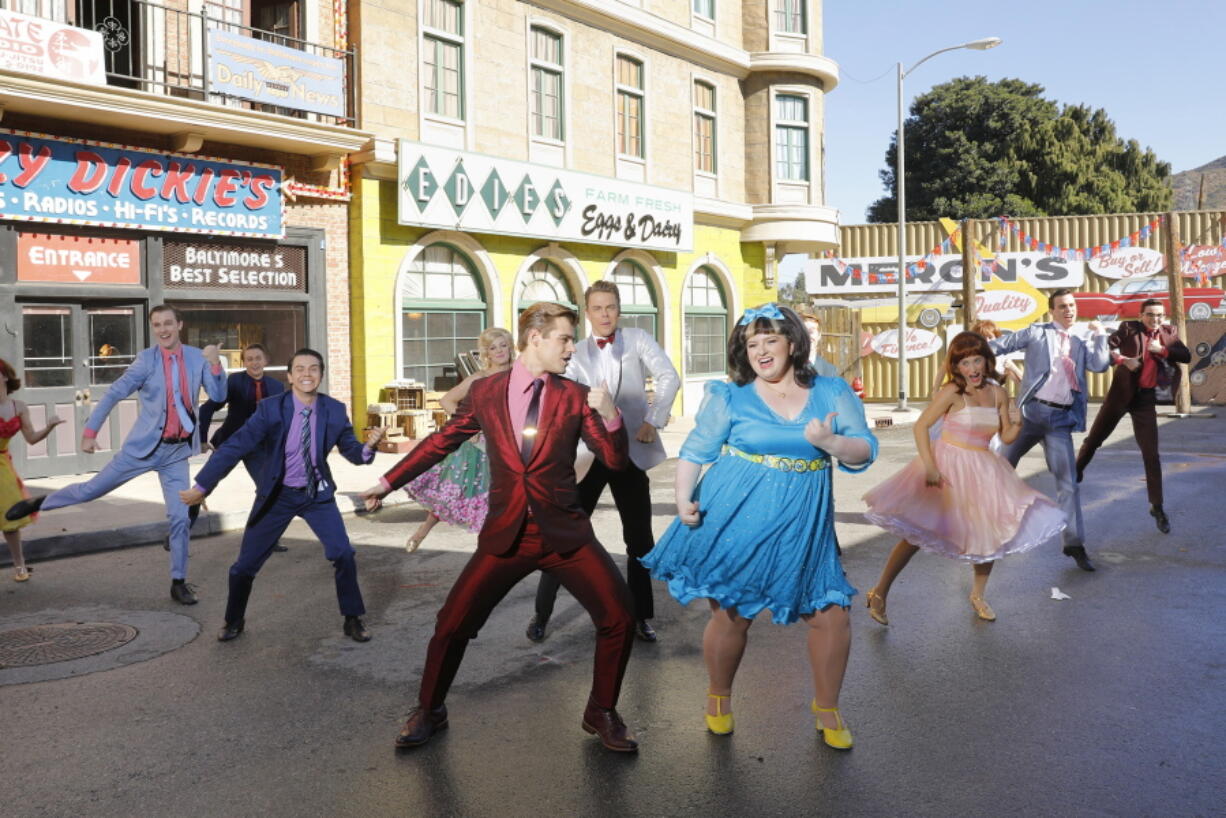 Derek Hough as Corny Collins, foreground left, and Maddie Baillio as Tracy Turnblad, foreground right, during a rehearsal for the musical &quot;Hairspray Live!,&quot; airing tonight.