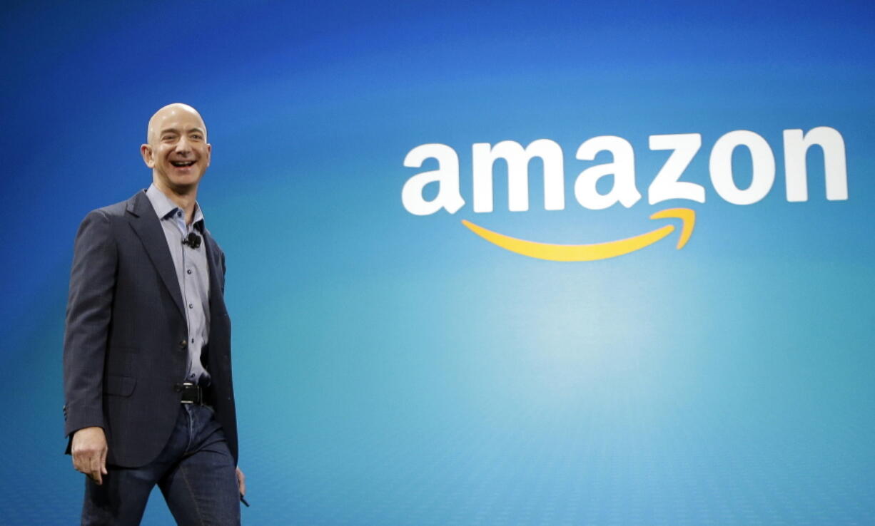 Amazon CEO Jeff Bezos walks onstage for the launch of the new Amazon Fire Phone, in Seattle in June.  (AP Photo/Ted S.