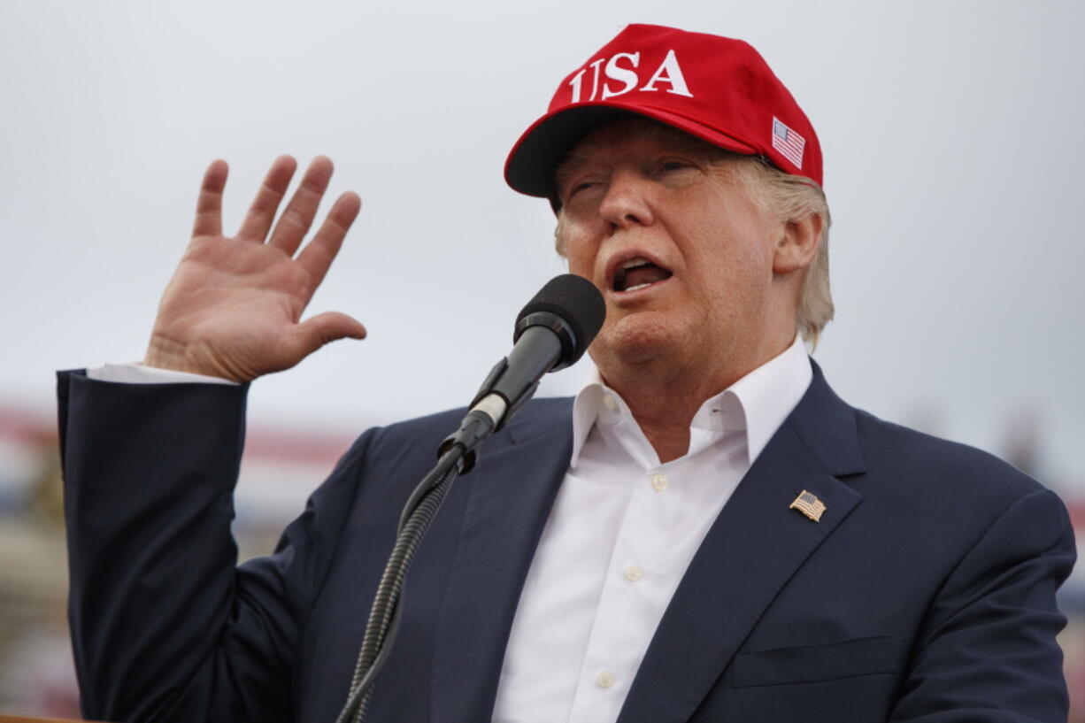 President-elect Donald Trump speaks during a rally at Ladd-Peebles Stadium in Mobile, Ala. Trump is poised to meet with his incoming national security adviser Wednesday in the aftermath of a rattling day of violence around the world.