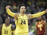 Oregon's Dillon Brooks, center, celebrates after scoring against Southern California during the second half of an NCAA college basketball game Friday, Dec. 30, 2016, in Eugene, Ore.