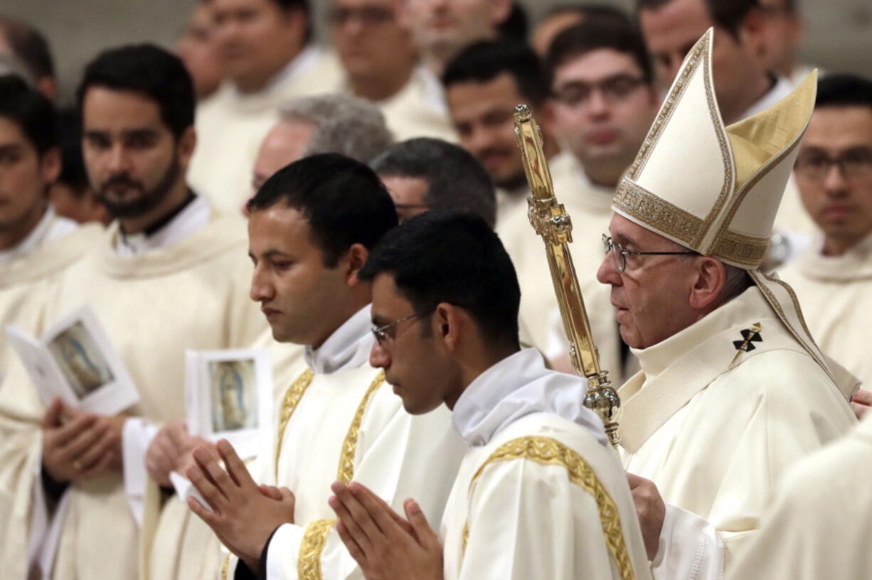 Pope Francis, right, celebrates a Mass to mark the feast of Our Lady of Guadalupe, in St. Peter&#039;s Basilica, at the Vatican on Monday.