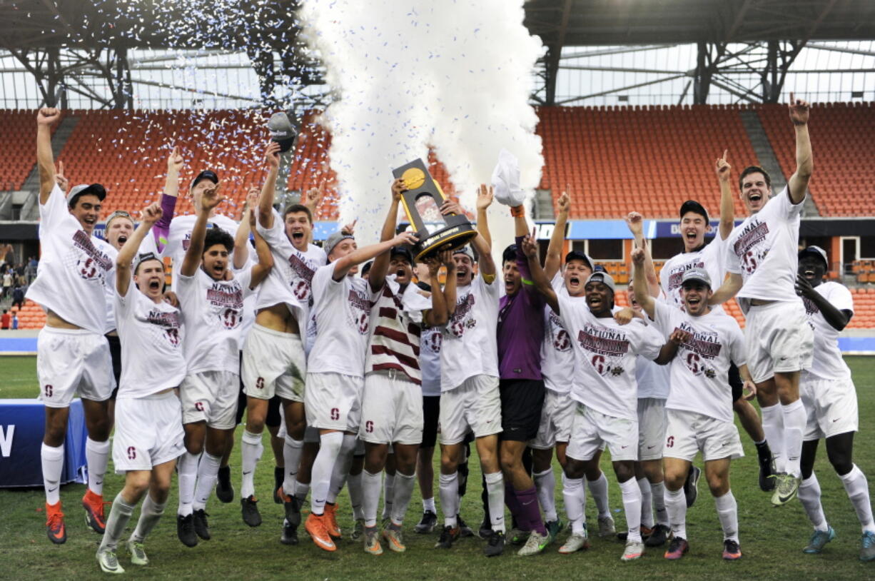 The Stanford players celebrate their win in penalty kicks over Wake Forest in an NCAA college soccer game, Sunday, Dec. 11, 2016, in Houston.