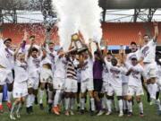 The Stanford players celebrate their win in penalty kicks over Wake Forest in an NCAA college soccer game, Sunday, Dec. 11, 2016, in Houston.