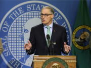 Washington Gov. Jay Inslee talks to reporters about his proposed budget, Wednesday, Dec. 14, 2016, in Olympia, Wash.  (AP Photo/Ted S.