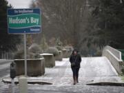 Keelie Wray of Vancouver navigates Evergreen Boulevard, which had areas of both slush and ice, Friday morning.