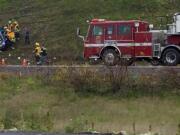 Two people were injured in a multiple-vehicle crash involving a school bus on Interstate 205 Friday afternoon. The school bus had about a dozen kids on board though none were reportedly injured.