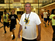 Hudson&#039;s Bay High School football coach Mark Oliverio at a gym workout for athletes at the school in Vancouver, Wa., Wednesday July 22, 2015.