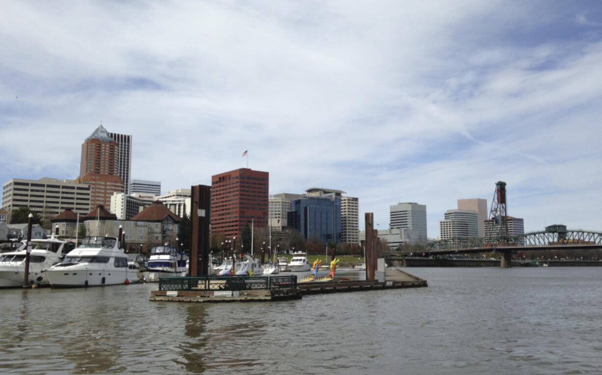 The Willamette River flows through downtown Portland. A cleanup program announced Friday will remove or encapsulate toxins from the vicinity of the Broadway Bridge to near the river&#039;s mouth across from Vancouver Lake.