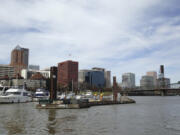 The Willamette River flows through downtown Portland. A cleanup program announced Friday will remove or encapsulate toxins from the vicinity of the Broadway Bridge to near the river&#039;s mouth across from Vancouver Lake.