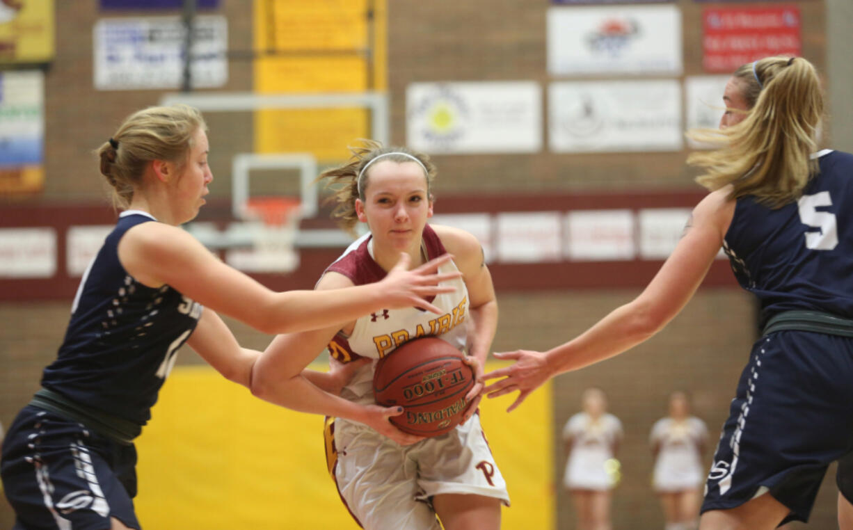 Prairie&#039;s Jozie Tangeman (center) blasts through Skyview&#039;s defenses in a game last month. Prairie is ranked fourth in the state by the Associated Press, but is 17th in RPI.