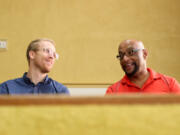 Pastor Kyle Meier, left, of Peak United Methodist Church, chats with Rev. James Taylor in the sanctuary of St. Mary AME Church in Apex, N.C.