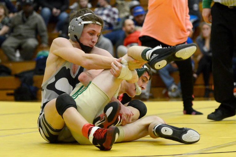 Union's Vitaliy Manolov tries to flip Evergreen's Ryan Logan at the Clark County Wresting Tournament at Hudson's Bay High School on Saturday, January 21, 2017. Manolov beat Logan to win the 120-pound weight class.