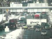 A jackknifed tractor-trailer blocks most of southbound Interstate 5 near its split with Interstate 205 after noon Thursday. Traffic was squeaking by in one lane.