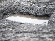 A pothole is seen at the intersection of Northeast 18th Street and 134th Avenue in Vancouver in January 2016.