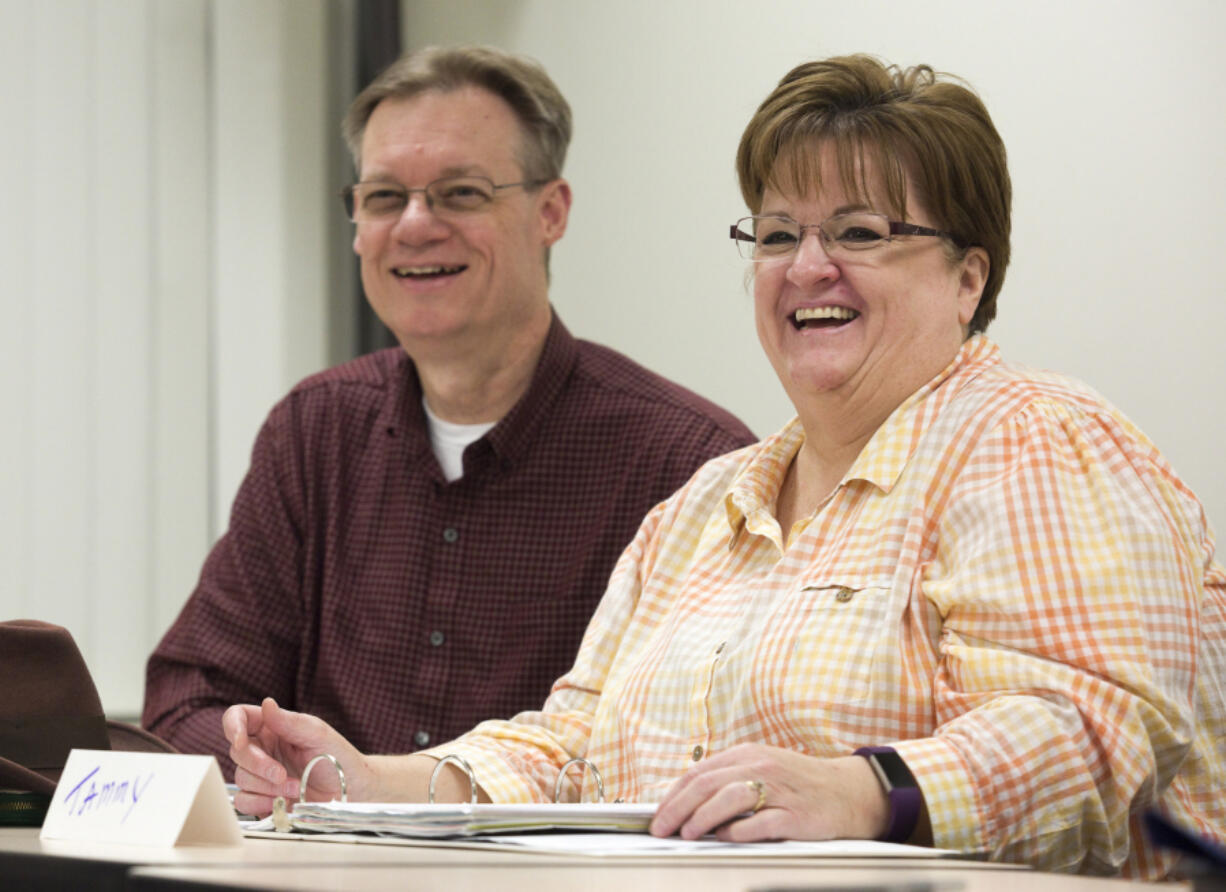 Eric and Tammy Huskisson share tips for getting creative with meal replacements in the HMR diet during a meeting Wednesday evening at the PeaceHealth Southwest Specialty Clinics in Vancouver. The HMR diet requires participants to use meal replacements and shakes to drop weight quickly.