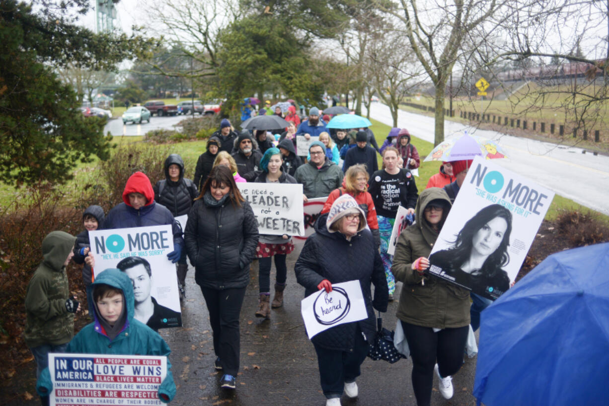 About 150 protesters march along the Vancouver waterfront during the Women&#039;s March on Saturday. The marchers, in solidarity with the Women&#039;s March on Washington, protested President Donald Trump&#039;s policies.