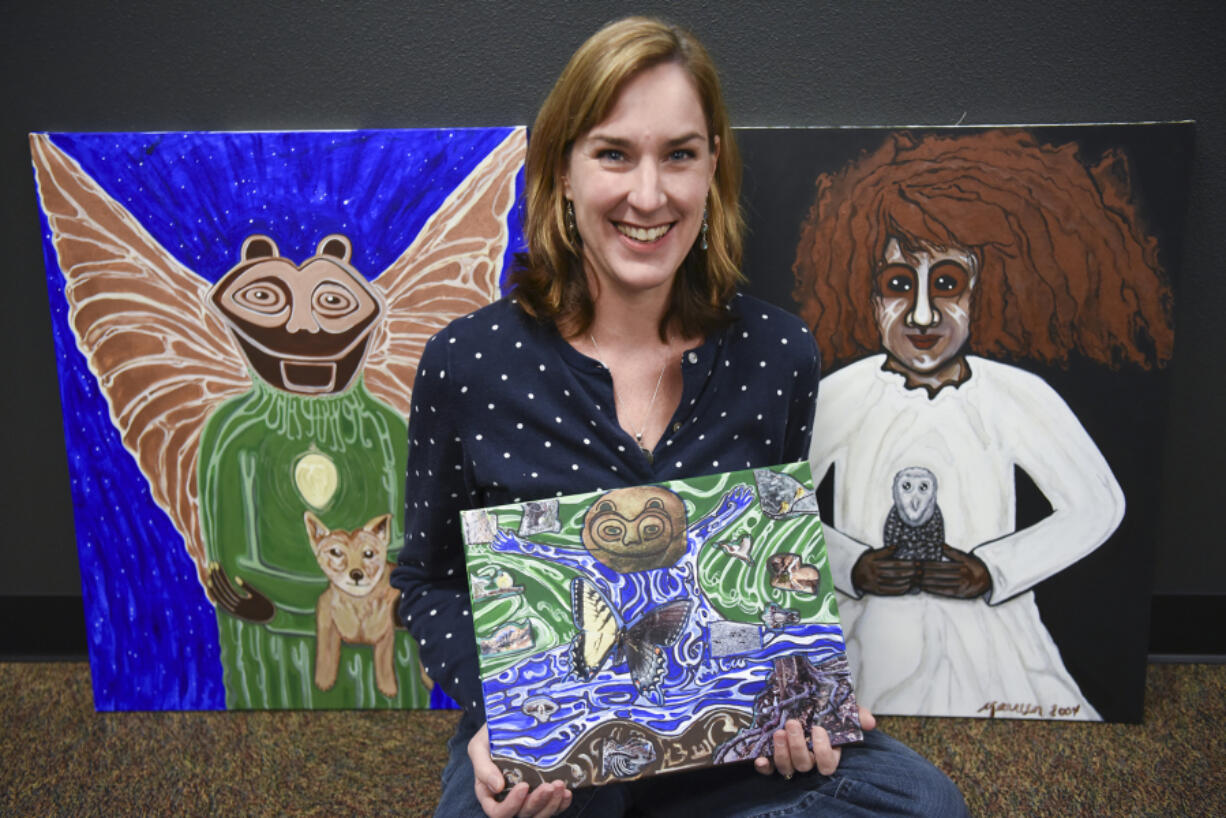 Maureen Andrade Montague, with art inspired by the Columbia Gorge pictograph &quot;She Who Watches,&quot; in the Fort Vancouver Visitors Center.