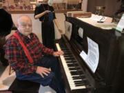 Washougal: Camas-Washougal Historical Society President Jim Cobb sits at one of the instruments the society is hoping to refurbish for display at Two Rivers Heritage Museum.