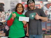 Battle Ground: Since opening, Mod Pizza has formed a partnership with the Battle Ground Education Foundation, and Colleen O&#039;Neal, left, president of the foundation, recently received accepted a $6,902 donation from the restaurant and Cory Hammond, Mod Pizza&#039;s manager.