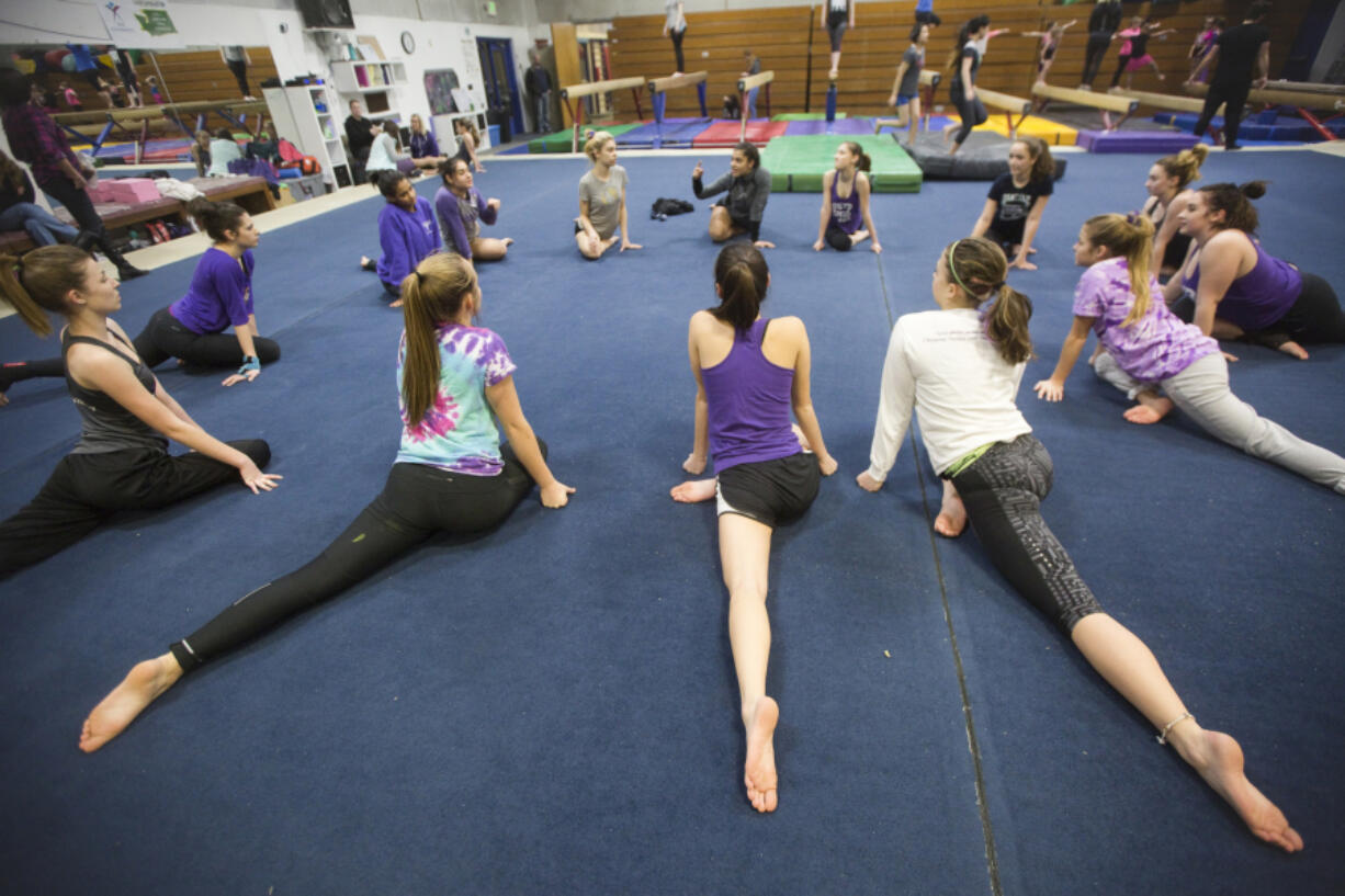 The growing gymnastics team from Columbia River High School practices at Naydenov Gymnastics center in Vancouver.