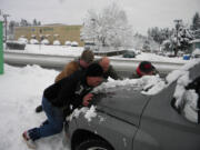 Members of the 4x4 rescue group help people in distress on Clark County&#039;s roads.