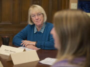 Sen. Patty Murray, left, listens as Alex Roberts of Hoesly Automotive speaks at The Marshall House on Oct. 26.