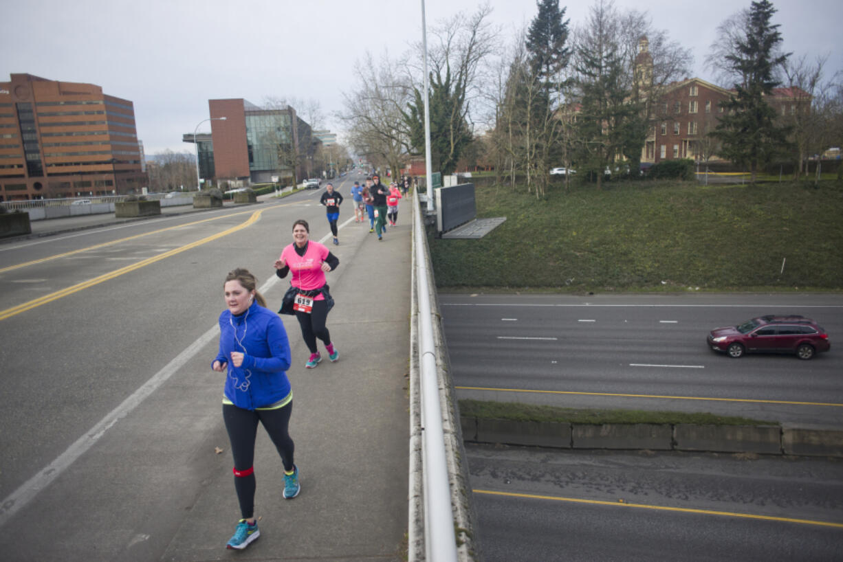 Runners make their way along the annual Race for Warmth route Sunday morning in Vancouver.