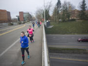 Runners make their way along the annual Race for Warmth route Sunday morning in Vancouver.