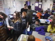 Art teacher Michelle Hankins points to art supplies from a crammed corner of her classroom at View Ridge Middle School. The Ridgefield School District will run a bond vote on Feb. 14 to help alleviate overcrowding in schools, partly by moving students out of Ridgefield onto a new campus across from the high school.