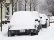 Snow and ice covered cars on Columbia River Drive in Vancouver on Dec. 21, 2008.