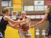 Prairie's Jozie Tangeman (C) blasts through Skyview's defenses in a girls basketball in Vancouver Tuesday December 13, 2016.