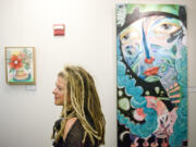 Vancouver artist Michelle Allen discusses her paintings during the Dec. 9 rededication of the sixth-floor art gallery in the Clark County Public Service Center as the Anstine Gallery.