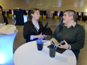 Christie McCallum, center, and Kylie Calzarette, right, attend a recruiting event for the Ilani Casino Resort on Saturday at the Clark County Event Center at the Fairgrounds.