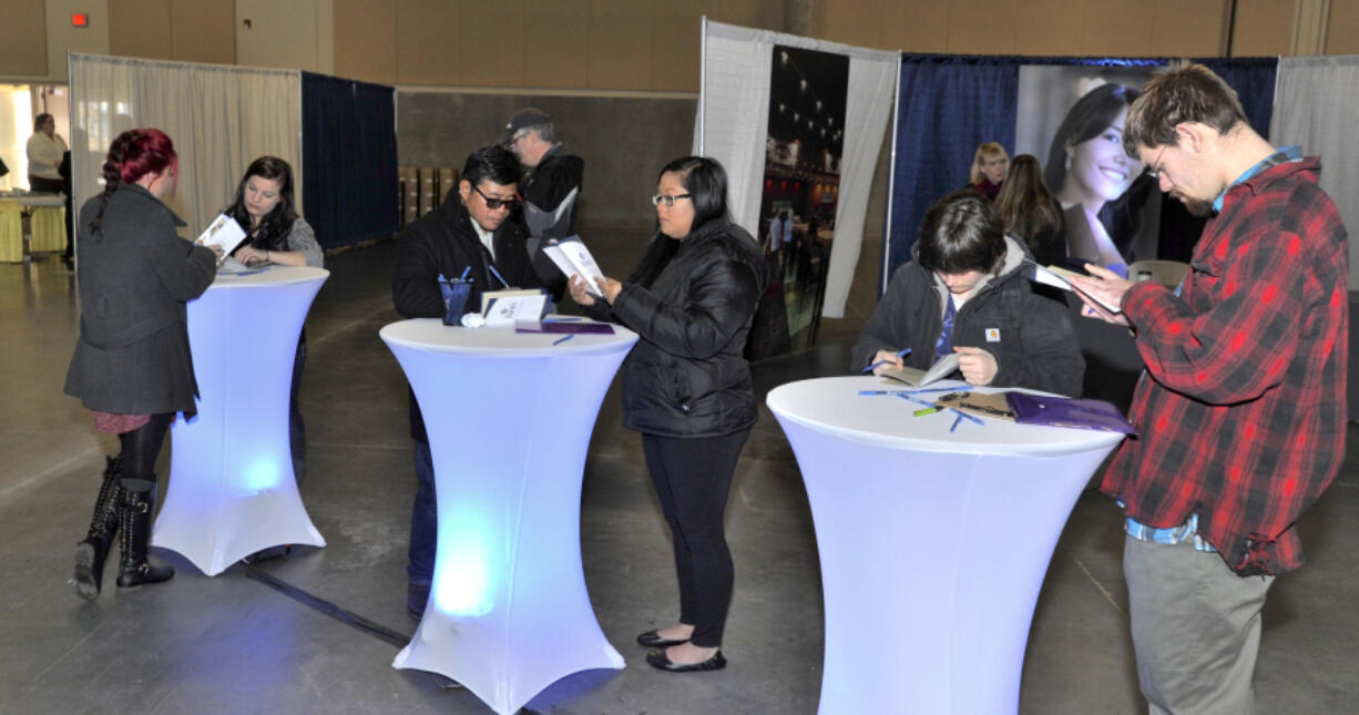 People attend a recruiting event for the Ilani Casino Resort held at the Clark County Event Center at the Fairgrounds earlier this month.