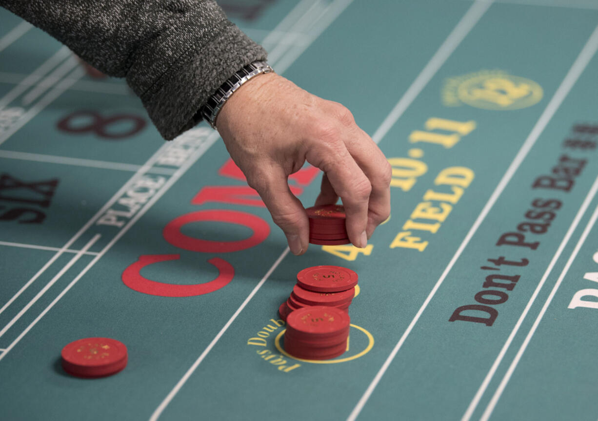 Participants learn more about the casino game &quot;Craps&quot; at Ilani Casino Resort on Friday morning, Jan. 13, 2017.