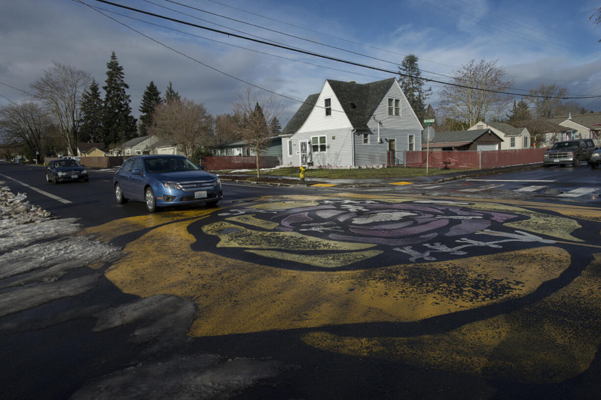 A street mural at the intersection of East 33rd and R streets has served as a traffic calming device aimed at encouraging drivers to slow down.