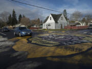 A street mural at the intersection of East 33rd and R streets has served as a traffic calming device aimed at encouraging drivers to slow down.