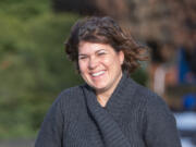 Clark College English professor Elizabeth Donley beams outside her office before heading to the Women&#039;s March on Washington in D.C. Donley is also division chair and literary adviser to Clark&#039;s art and literary magazine Phoenix.