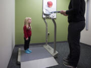 Haddie Brans, 4, stands on a scale during a checkup Tuesday at the Child &amp; Adolescent Clinic in Salmon Creek. Haddie&#039;s mom, Angela Brans, scheduled the checkup six weeks earlier; Tuesday was the soonest they could get an appointment.