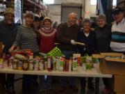 Esther Short: Members of the Happy Hoppers Square Dance Club sort through food donated to FISH of Vancouver during December&#039;s Walk &amp; Knock food drive.