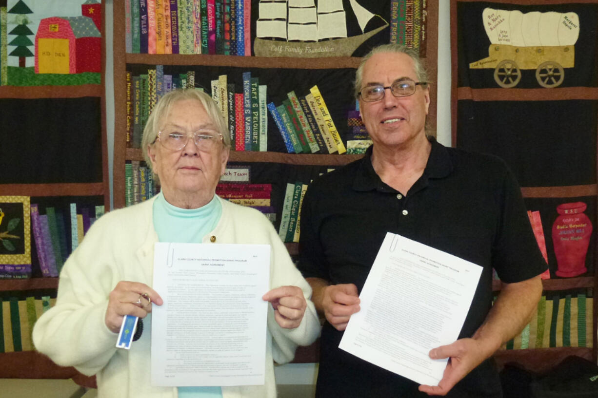 Edgewood Park: Clark County Genealogical Society past president Lethene Parks, left, and President Brian Runyan hold up some Clark County tax records from 1886 and 1891, which the society will soon be able to digitize thanks to a grant from the Clark County Department of Community Planning.