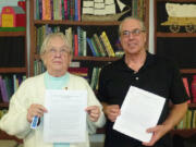 Edgewood Park: Clark County Genealogical Society past president Lethene Parks, left, and President Brian Runyan hold up some Clark County tax records from 1886 and 1891, which the society will soon be able to digitize thanks to a grant from the Clark County Department of Community Planning.