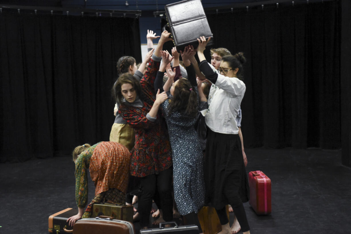 Students in the advanced theater class at Vancouver School of Arts and Academics rehearse an original production, &quot;Neither Nor Both And: What&#039;s Left Behind,&quot; in the black box theater. Theater teacher Judy Goff and VSAA alumnus Spenser Theberge collaborated on the original play.