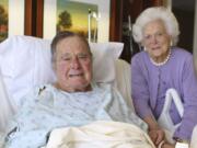 In this photo provided by Office of George H.W. Bush on Monday Jan. 23, 2017, former President George H.W. Bush and his wife Barbara pose for a photo at Houston Methodist Hospital in Houston. The 92-year-old former president is still suffering from pneumonia, but is well enough to leave the intensive care unit at a Houston hospital, doctors said Monday. His wife, Barbara, has been discharged from the same facility after completing treatment for bronchitis. (Courtesy the Office of George H.W.