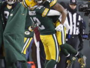 Green Bay Packers quarterback Aaron Rodgers (12) celebrates with wide receiver Randall Cobb (18) after throwing a touchdown pass to Cobb during the first half of an NFC wild-card NFL football game, Sunday, Jan. 8, 2017, in Green Bay, Wis.